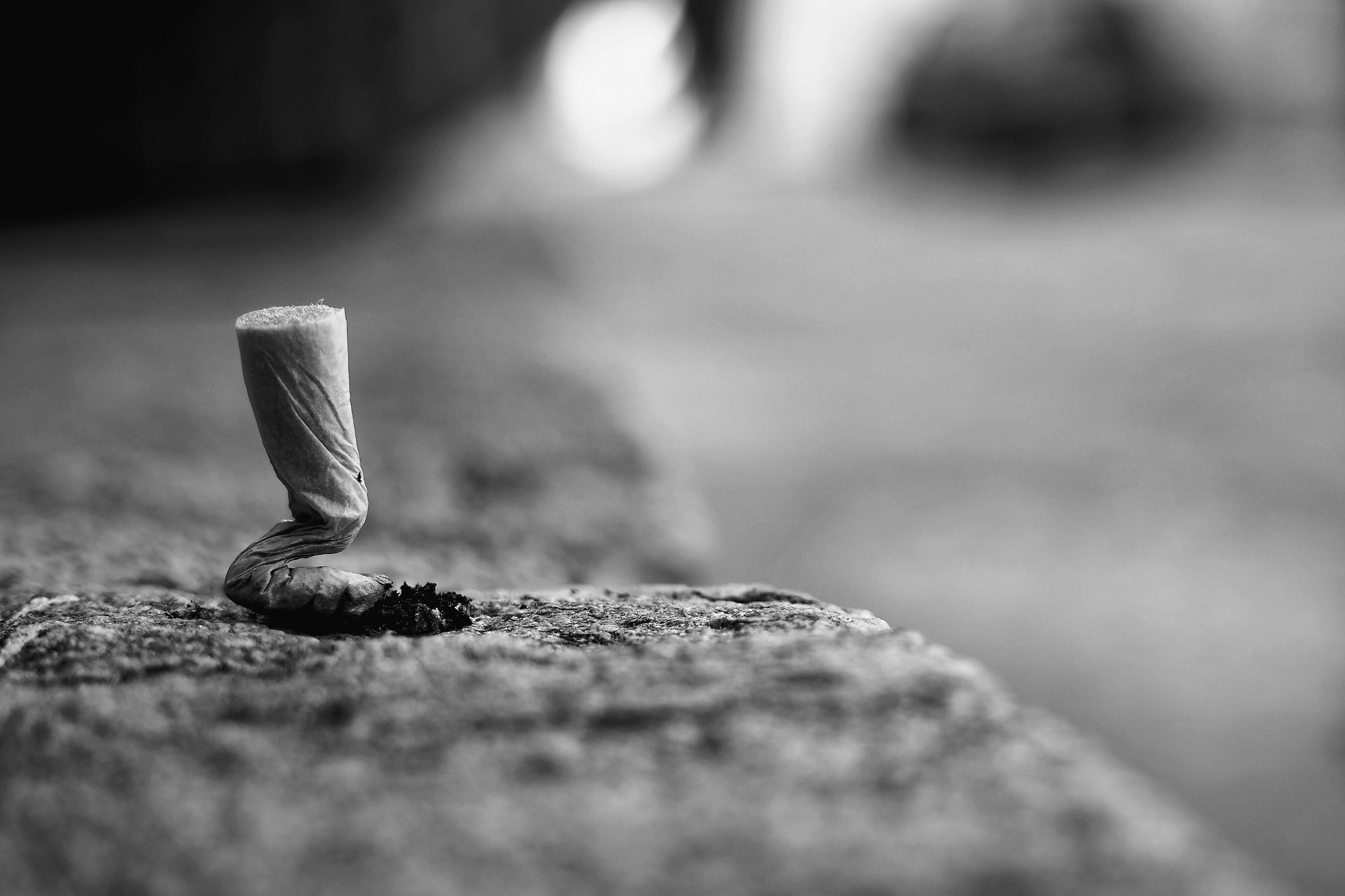 Discarded cigarette butt, symbolising the habit left behind
