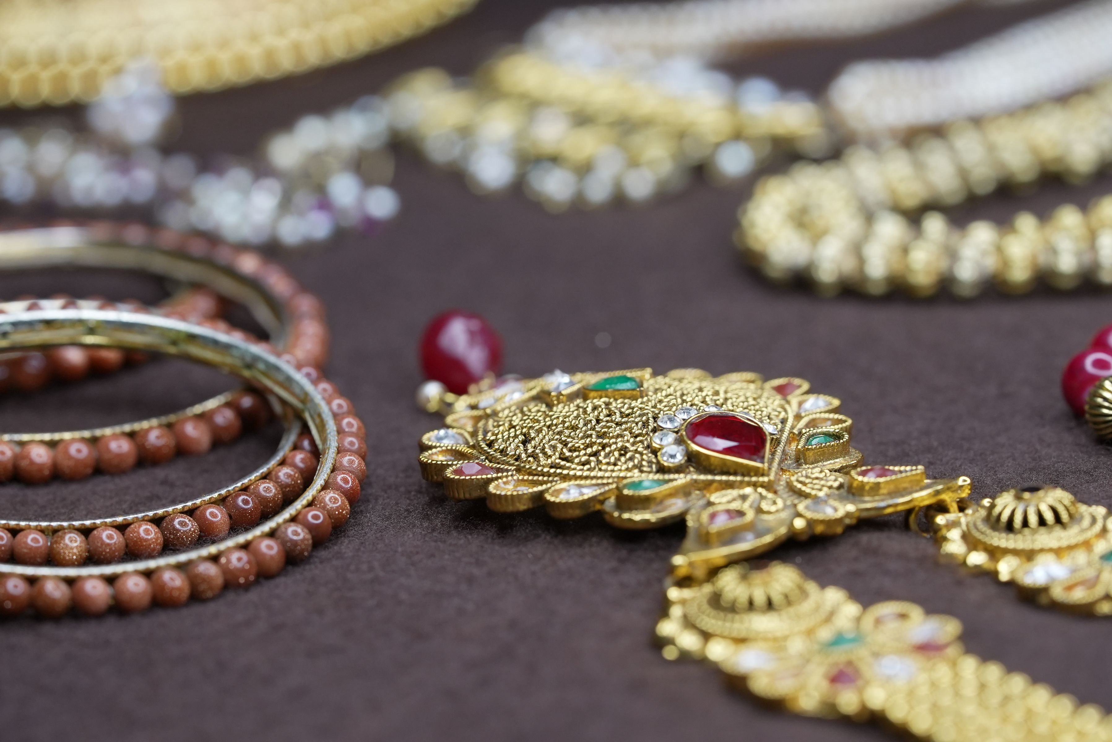 Close-up of ornate traditional gold jewellery on display